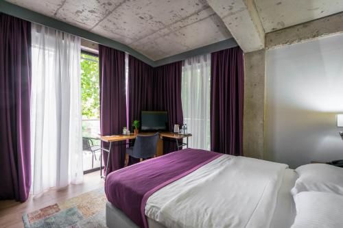 Postel nebo postele na pokoji v ubytování Hotel Adora
