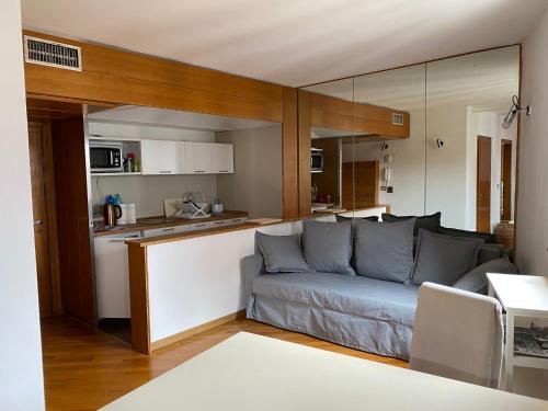a living room with a couch and a kitchen at Anzolo Palace - Rooms & Apartments in Venice