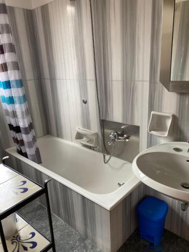 a bathroom with a bath tub and a sink at Anzolo Palace - Rooms & Apartments in Venice