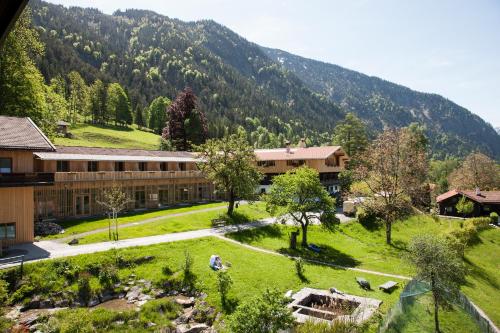 a campus with a mountain in the background at Tannerhof - Mein Versteck in den Bergen in Bayrischzell