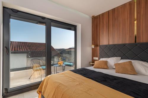 Postel nebo postele na pokoji v ubytování Apartments Aldo