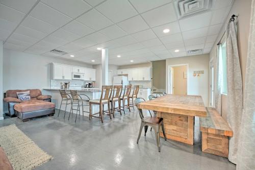 a kitchen and dining room with a wooden table and chairs at Coldwater Family Retreat with Boat Dock and Grill! in Coldwater