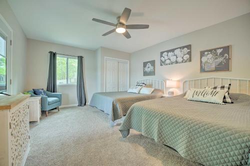 a bedroom with two beds and a ceiling fan at Coldwater Family Retreat with Boat Dock and Grill! in Coldwater