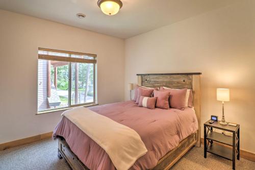 a bedroom with a large bed and a window at Flathead Lake Getaway with Balcony, Fireplace! in Somers