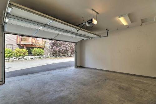 an empty garage with an open door to a street at Flathead Lake Getaway with Balcony, Fireplace! in Somers