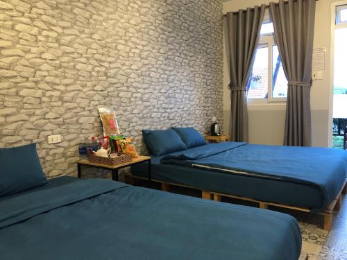 Katil atau katil-katil dalam bilik di Pine Tree Homestay