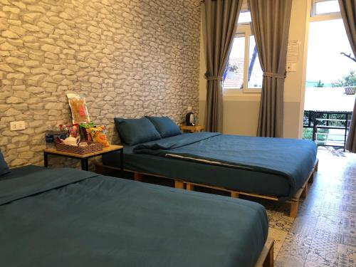 Katil atau katil-katil dalam bilik di Pine Tree Homestay