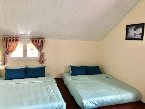 Katil atau katil-katil dalam bilik di Pine Tree Homestay