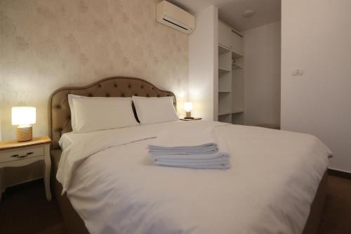 Postel nebo postele na pokoji v ubytování Perla Sudului - Residence
