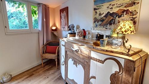a kitchen with a wooden counter top in a room at Studio Malow in Arques