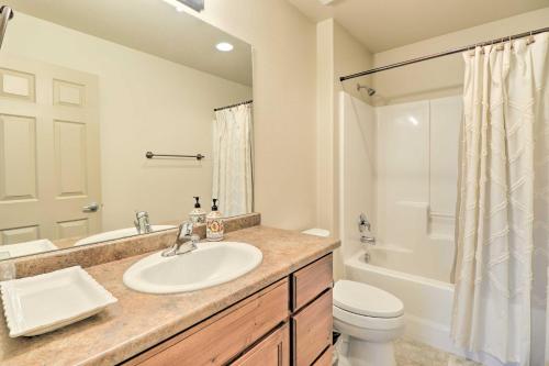 a bathroom with a sink and a toilet and a shower at Columbia Falls Home with 1-Acre Yard and Views! in Columbia Falls