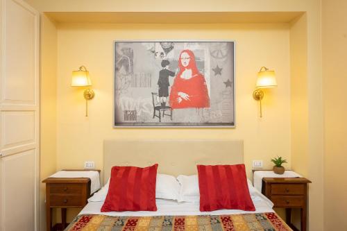 1 dormitorio con 1 cama y una pintura en la pared en InternoUno Deluxe, en Roma