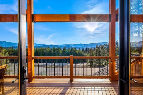 a view from the balcony of a cabin with a view of the mountains at Pool Access Cle Elum Mtn-View Cabin with Game Room in Cle Elum