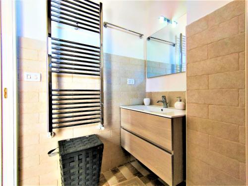 a bathroom with a sink and a shower at Da Lorenza di Casa Camilla Journey in Depressa