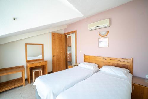 Katil atau katil-katil dalam bilik di Fora Apart Hotel