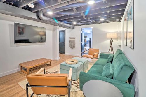 a living room with a green couch and chairs at Dreamy St Charles Retreat with Furnished Patio! in St. Charles
