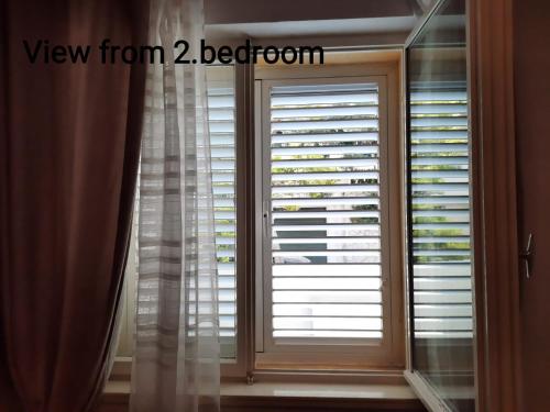 a window with a view from bedroom at Apartment & bedroom D&M2 in Makarska