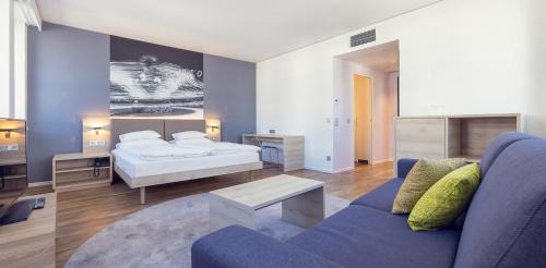 Postel nebo postele na pokoji v ubytování roomz Vienna Prater