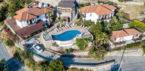 an overhead view of a house with a swimming pool at Les Terrasses De Selimiye in Selimiye