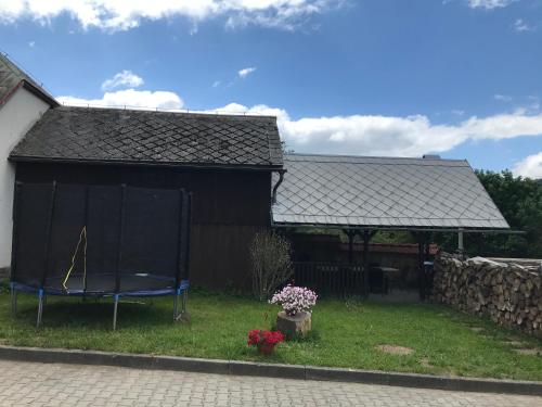 a house with a stage in the yard at Hájenka Čenkovice in Čenkovice