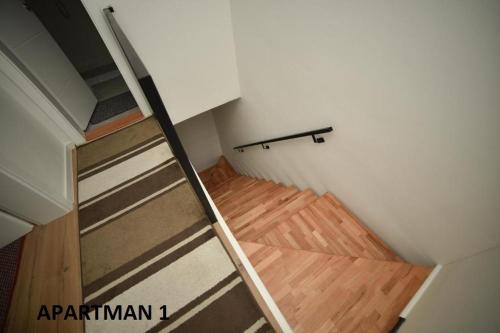 a stairwell in a room with a ladder at Apartman Slatki dom 1 in Sarajevo