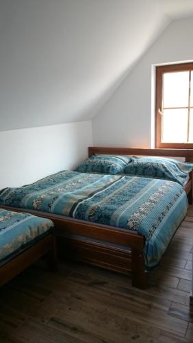 Postel nebo postele na pokoji v ubytování Vinařství Miroslav Jambor