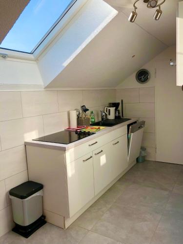 a kitchen with a sink and a counter top at Ferienwohnung Marienhöhe in Nördlingen