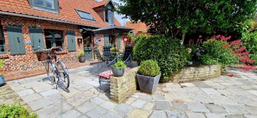 a bike parked in front of a brick house at Studio Malow in Arques