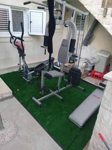 a gym with two tread machines and a treadmill at Apartments with sea view in Prcanj in Kotor