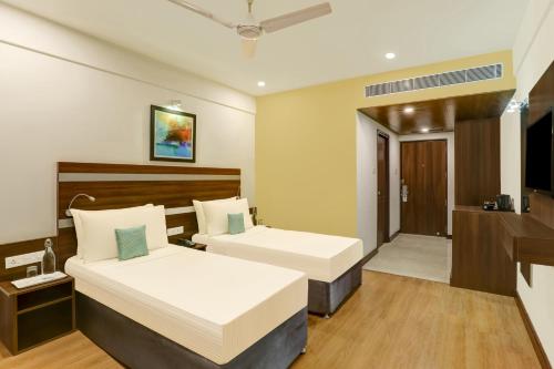 Ένα ή περισσότερα κρεβάτια σε δωμάτιο στο Lemon Tree Hotel, Port Blair Near to Airport