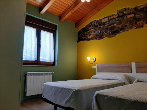 Posteľ alebo postele v izbe v ubytovaní Vivienda Turistica