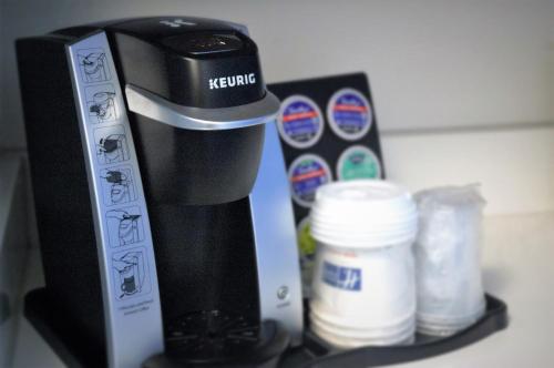 a coffee maker sitting on top of a shelf at Holiday Inn Express & Suites - Edmonton SW – Windermere by IHG in Edmonton