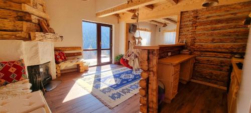 a room with wooden walls and a wooden floor at Casa Bună Fundățica in Fundăţica