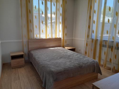 a bedroom with a bed and a window at Melkonyan's home in Gyumri