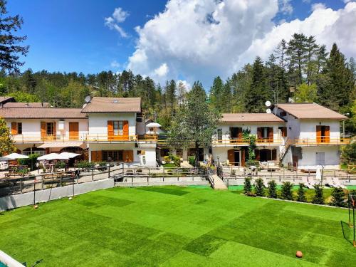 a large lawn in front of a building at Green Riviera Case Vacanza in Borzonasca