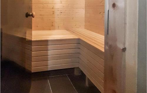 a wooden sauna with a wooden bench in a room at Beautiful Home In Vrådal With Sauna in Vradal