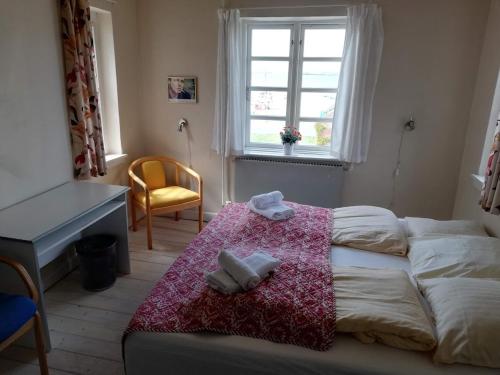Ліжко або ліжка в номері Det Gamle Hotel Rudkøbing