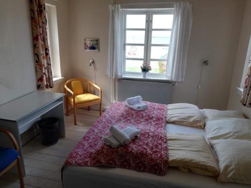 Voodi või voodid majutusasutuse Det Gamle Hotel Rudkøbing toas