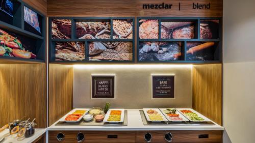 a display case with many different types of food at Hampton Inn By Hilton Nuevo Vallarta in Nuevo Vallarta 