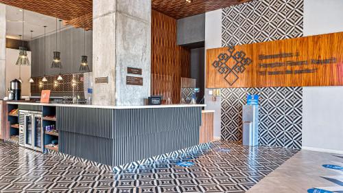 a kitchen with a counter and a tile floor at Hampton Inn By Hilton Nuevo Vallarta in Nuevo Vallarta 