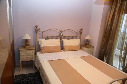 Postel nebo postele na pokoji v ubytování Villa Olympus