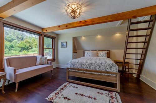 a bedroom with a bunk bed and a couch at Trinidad Pearl in Trinidad