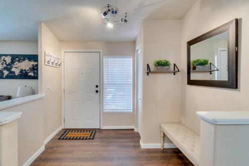 a hallway with a white door and a mirror at Amazing 3 Bed, 2 Bath Cabin between Flagstaff & Sedona in Munds Park