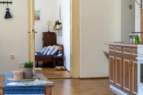 a kitchen with a table and a couch in a room at Vila Heide in Česká Kamenice