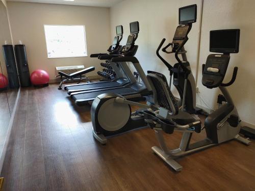 a gym with several tread machines in a room at Holiday Inn Express Murrysville - Delmont by IHG in Delmont