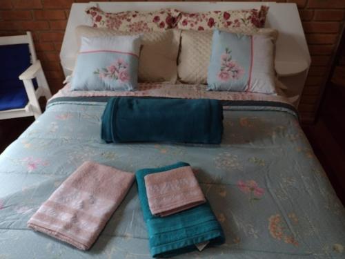 A bed or beds in a room at Casa de Campo Meu Pequeno Paraíso