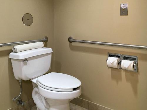 a bathroom with a toilet and two rolls of toilet paper at Comfort Inn & Suites near Kino Sports Complex in Tucson