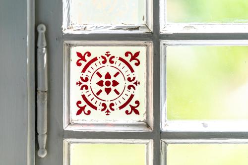 a door with a red and white design on it at Vila Heide in Česká Kamenice