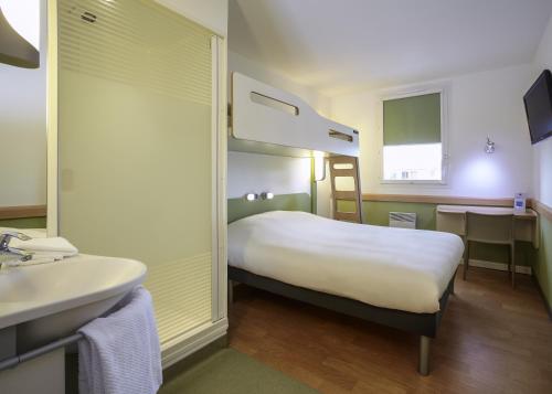 Un ou plusieurs lits dans un hébergement de l'établissement ibis budget Tours Nord