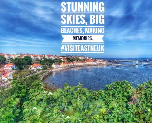 a poster of a beach with the words sunshine skies big beaches making memories at Beach House Walk - Crail - Home from Home in Crail